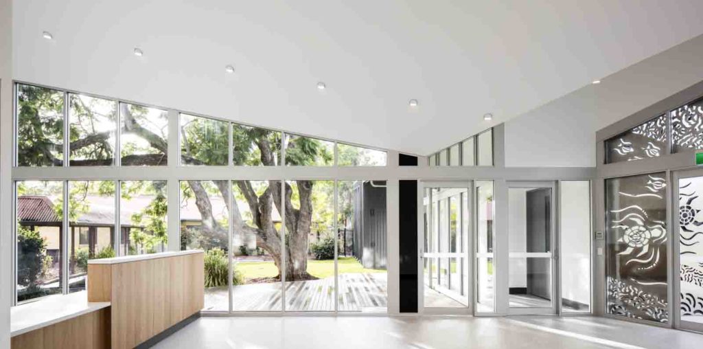 KaunitzYeung_PurfleetClinic_Taree_0013-1024x508.jpg Interior of a beautiful medical centre with a glass wall looking out to a garden