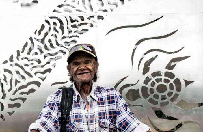 Milton-Saunders-cover.jpg Biripi elder, Milton Saunders, in front of the new Biripi Clinic at Purfleet