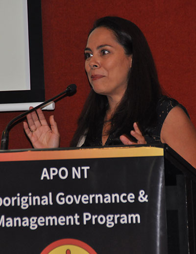 Dayna Lister speaking at a lecturn