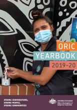Cover of ORIC's yearbook for 2020–21 showing a photo of a boardroom with an Aboriginal man holding a mic with