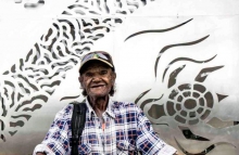 Milton-Saunders-cover.jpg Biripi elder, Milton Saunders, in front of the new Biripi Clinic at Purfleet