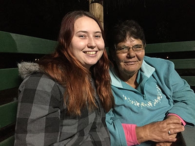 Two women smile at the camera