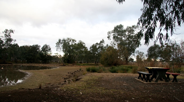 A picnic table near the water's edge