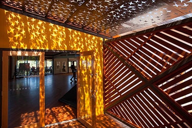 A ceiling with stars cut into it