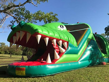 A bouncy castle in the shape of a large crocodile
