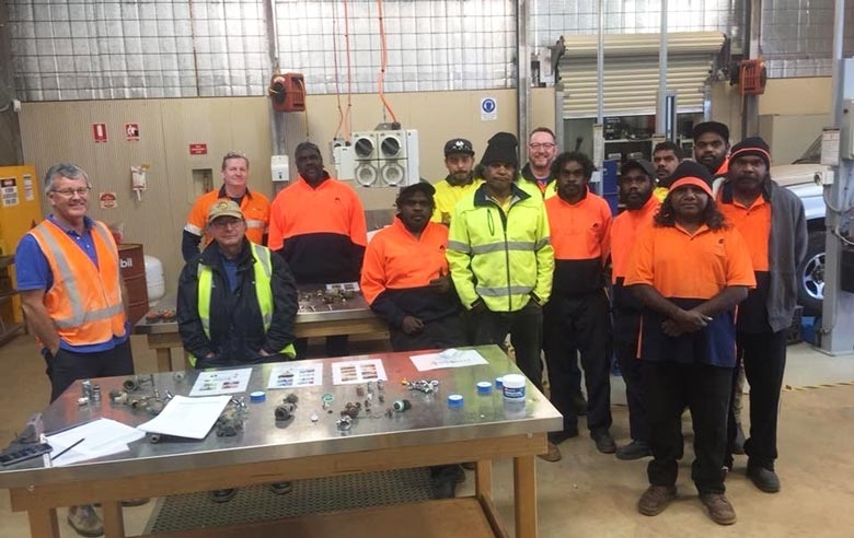 A group of people in an indoor workshop