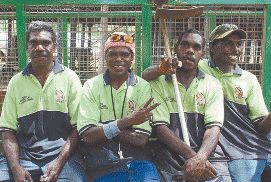 Four men in hi vis smile at the camera