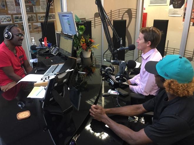 Three people in a radio studio