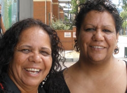 Two women smile at the camera