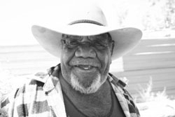 A black and white photo of an Aboriginal man