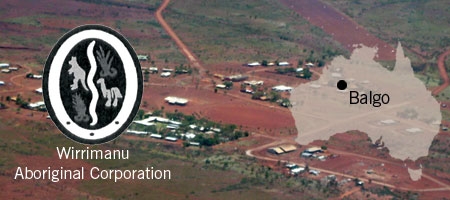 An aerial photograph of a remote town, which is overlaid by the Wirrimanu Aboriginal Corporation logo and a map of Australia with Balgo marked on it