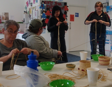 Several people working with long fibres