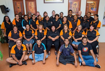 A large group of people pose for the camera