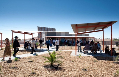 People in an outdoor area near a building