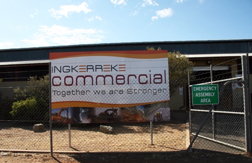 A large sign outside a building. The sign says Ingkerreke Commercial: Together we are stronger