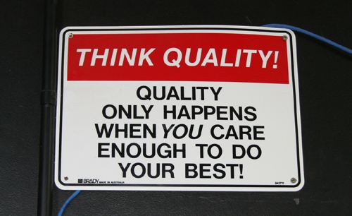 A sign that says Think quality. Quality only happens when you care enough to do your best