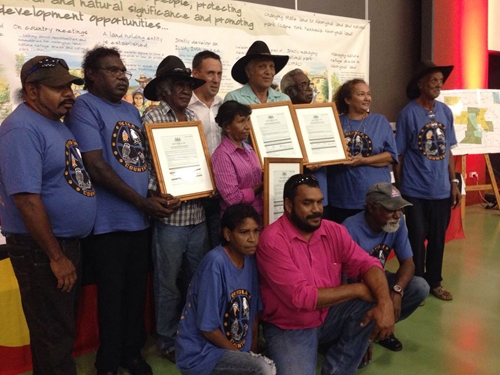 A group of people holding certificates