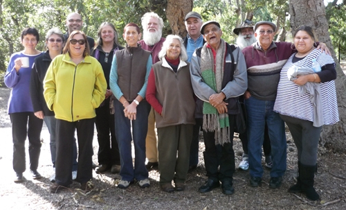 A group of people pose in an outdoor area