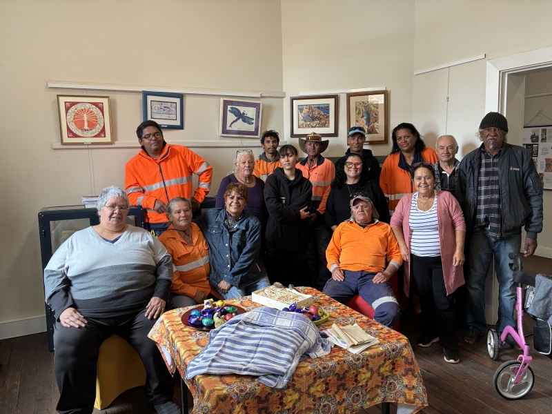 A group of people, many in hi vis, pose for the camera